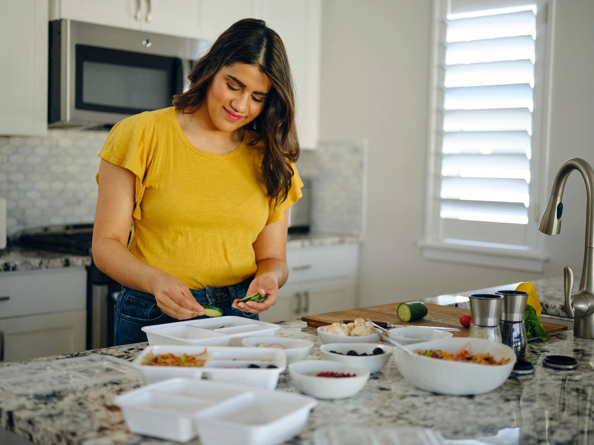 Woman preparing nourishing meals in a home kitchen