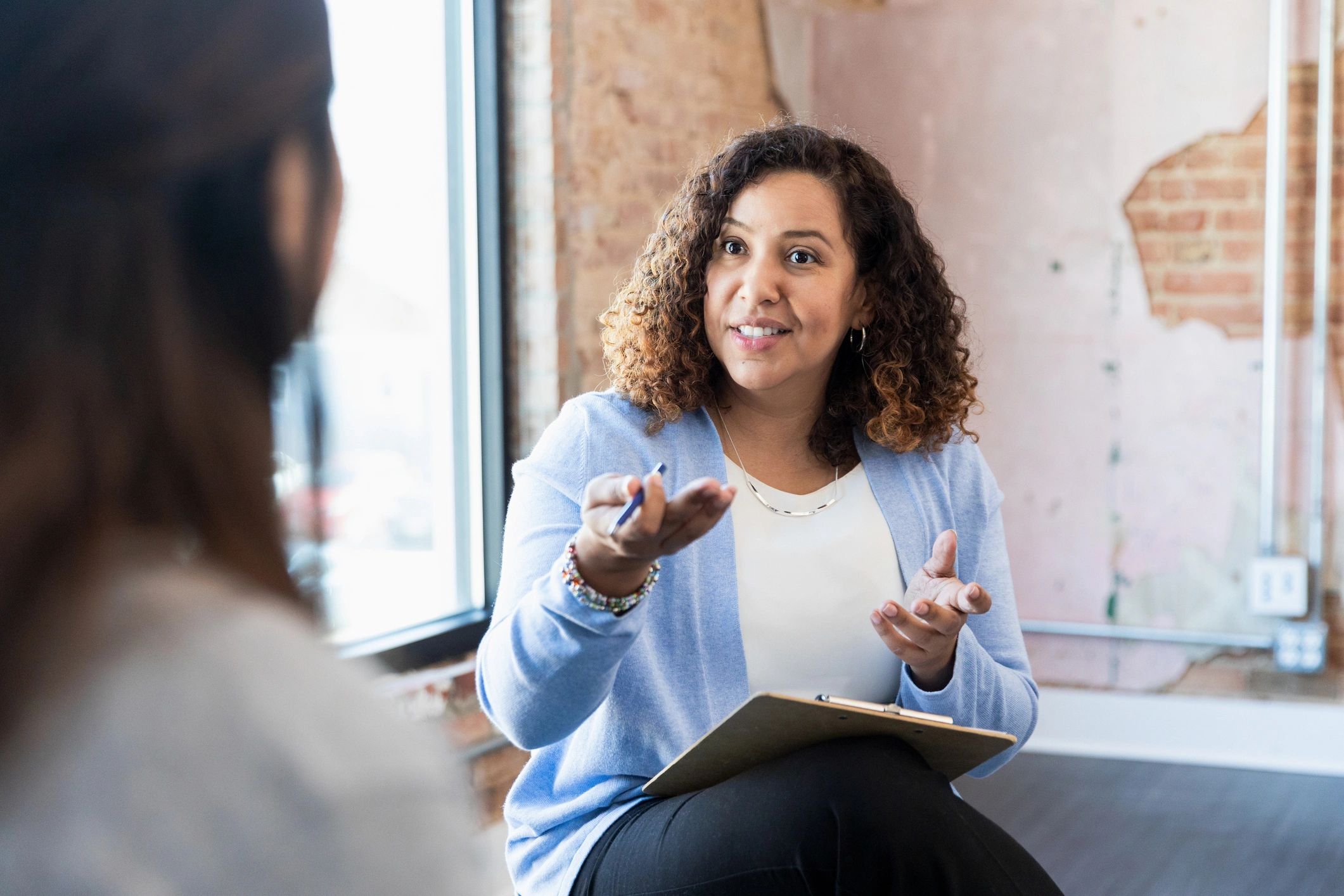 One-on-one coaching conversation in a calm setting