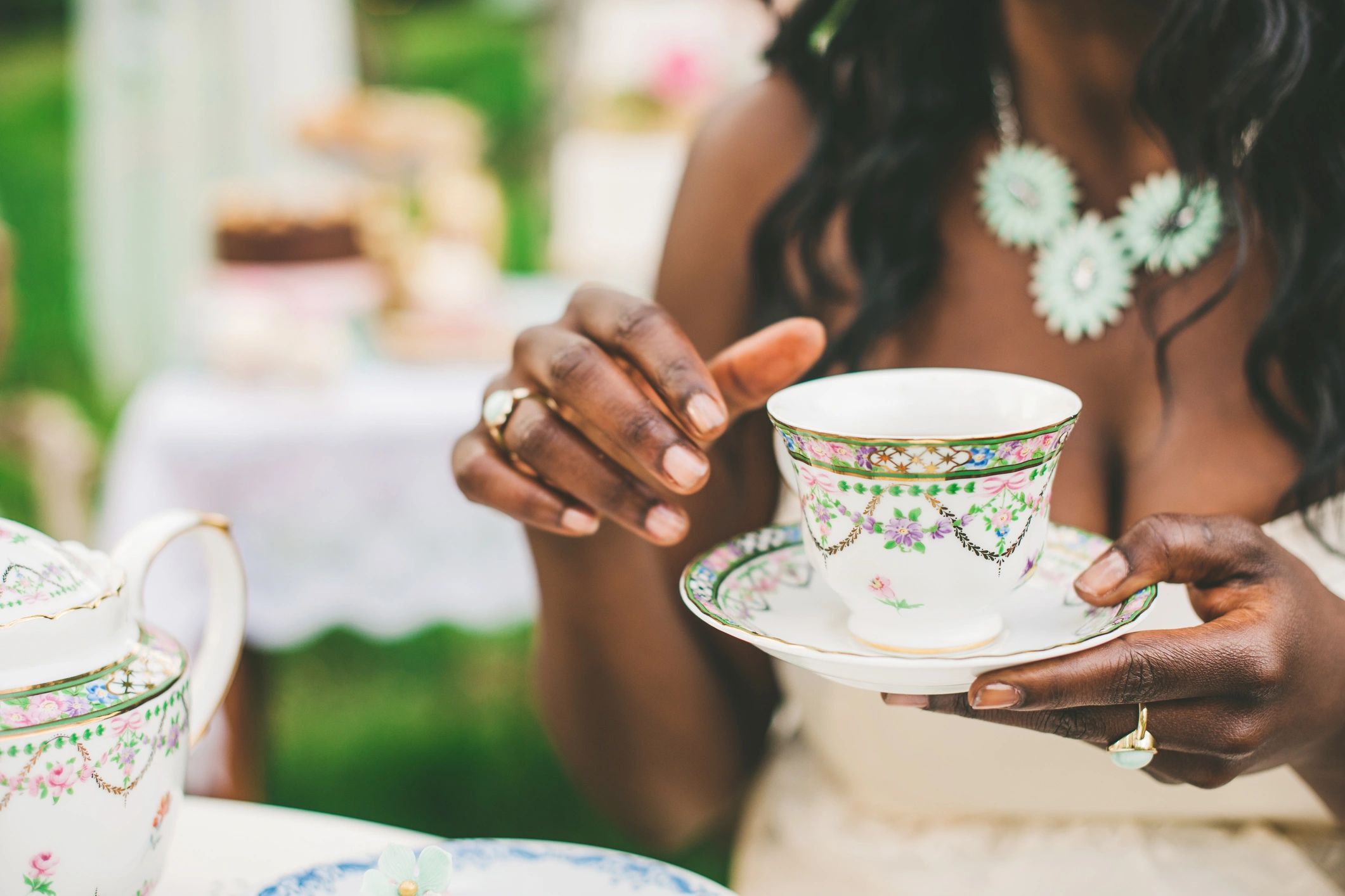 Tea gathering outdoors with people sharing a calm moment